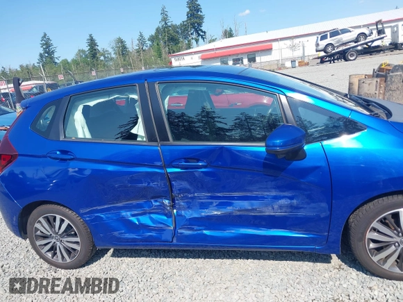 2015 Honda Fit EX-L z VIN 3HGGK5H83FM732503, wystawiony jako IAAI lot #42397823 z przebiegiem 87 522 mil mil oraz . Historia ofert i sprzedaży dostępna na DreamBid. Obrazek 13.