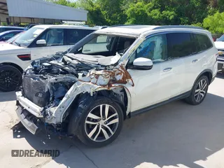 2016 Honda Pilot Touring with VIN 5FNYF6H97GB088824, listed as a IAAI auction lot 41991803 with 84,761 mi miles. Bid and sale history available at carsss.com. Image 18.
