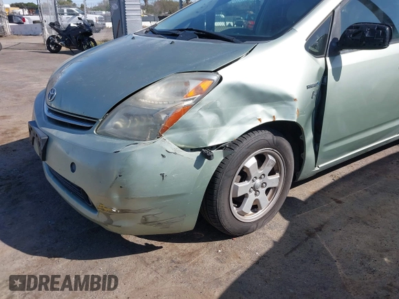 2007 Toyota Prius z VIN JTDKB20U877556527, wystawiony jako IAAI lot #41965245 z przebiegiem 259 572 mil mil oraz . Historia ofert i sprzedaży dostępna na DreamBid. Obrazek 6.