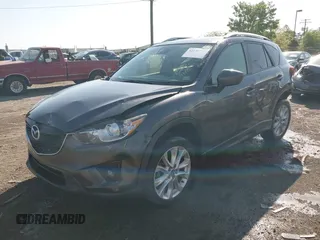 2014 Mazda CX-5 Grand Touring with VIN JM3KE4DY2E0312952, listed as a IAAI auction lot 42138721 with 99,993 mi miles and . Bid and sale history available at DreamBid. Image 2.