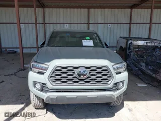 2023 Toyota Tacoma 4WD SR with VIN 3TMCZ5ANXPM613857, listed as a IAAI auction lot 41771957 with 76,232 mi miles. Bid and sale history available at carsss.com. Image 12.