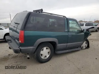 1998 Chevrolet Tahoe z VIN 3GNEK18R4WG128424, wystawiony jako Copart lot #79684984 z przebiegiem 217 456 mil mil oraz Szkoda całkowita • Salvage title. Historia ofert i sprzedaży dostępna na DreamBid. Obrazek 3.