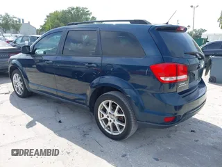 2014 Dodge Journey SXT with VIN 3C4PDCBG3ET218328, listed as a IAAI auction lot 42086656 with 55,620 mi miles. Bid and sale history available at carsss.com. Image 3.