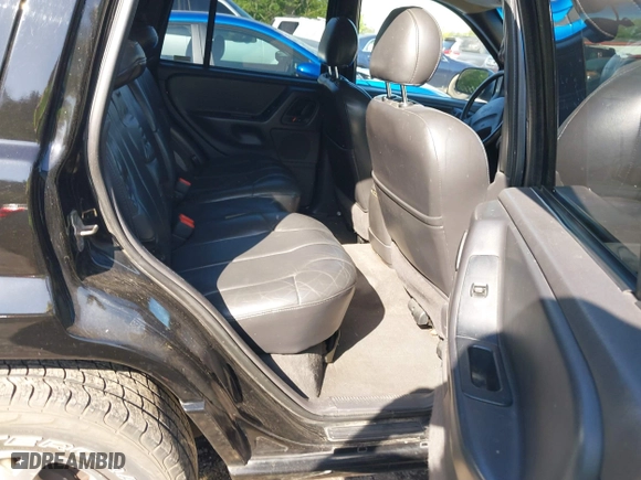 1999 Jeep Grand Cherokee Laredo with VIN 1J4GW58S5XC687480, listed as a IAAI auction lot 42016415 with 186,776 mi miles. Bid and sale history available at carsss.com. Image 8.