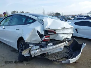 2022 Tesla Model 3 with VIN 5YJ3E1EA1NF167711, listed as a IAAI auction lot 41594266 with 50,554 mi miles and . Bid and sale history available at DreamBid. Image 6.