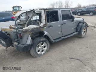2013 Jeep Wrangler Unlimited Sahara with VIN 1C4BJWEG4DL612947, listed as a IAAI auction lot 41644376 with 85,563 mi miles. Bid and sale history available at carsss.com. Image 4.