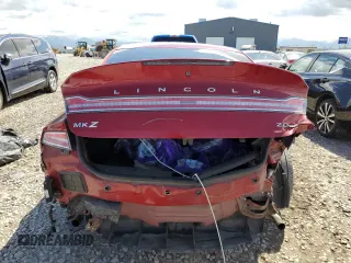 2013 Lincoln MKZ z VIN 3LN6L2G95DR804619, wystawiony jako Copart lot #57101315 z przebiegiem Nie podano mil oraz Szkoda całkowita • Salvage title. Historia ofert i sprzedaży dostępna na DreamBid. Obrazek 6.