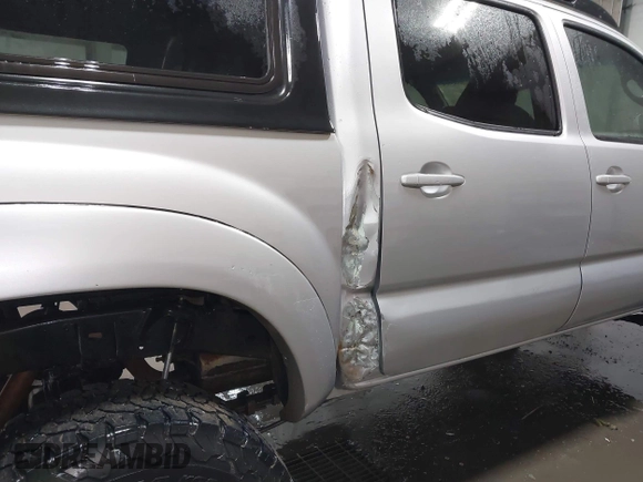 2011 Toyota Tacoma with VIN 3TMLU4EN9BM070836, listed as a IAAI auction lot 41668595 with 89,879 mi miles and . Bid and sale history available at DreamBid. Image 6.
