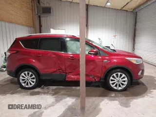 2017 Ford Escape Titanium z VIN 1FMCU9J9XHUC20359, wystawiony jako IAAI lot #41938688 z przebiegiem 79 743 mil mil oraz . Historia ofert i sprzedaży dostępna na DreamBid. Obrazek 13.
