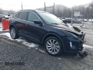 2021 Ford Escape Titanium z VIN 1FMCU9J95MUA21763, wystawiony jako IAAI lot #41575044 z przebiegiem Nie podano mil oraz . Historia ofert i sprzedaży dostępna na DreamBid. Obrazek 1.