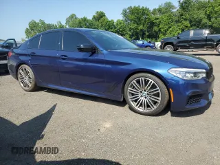 2020 BMW 5 Series M550i xDrive with VIN WBAJS7C0XLBN96338, listed as a Copart auction lot 60591815 with 73,910 mi miles and Salvage title. Bid and sale history available at DreamBid. Image 4.