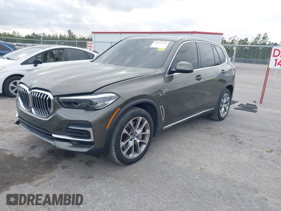 2022 BMW X5 xDrive45e z VIN 5UXTA6C00N9L06383, wystawiony jako IAAI lot #38552162 z przebiegiem 19 592 mil mil oraz . Historia ofert i sprzedaży dostępna na DreamBid. Obrazek 17.