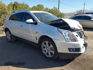 2013 Cadillac SRX Performance Collection with VIN 3GYFNDE37DS599557, listed as a IAAI auction lot 41633569 with 100,611 mi miles and . Bid and sale history available at DreamBid. Image 1.