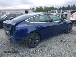 2018 Tesla Model 3 Long Range Battery z VIN 5YJ3E1EBXJF092025, wystawiony jako IAAI lot #42268369 z przebiegiem 132 687 mil mil oraz . Historia ofert i sprzedaży dostępna na DreamBid. Obrazek 4.