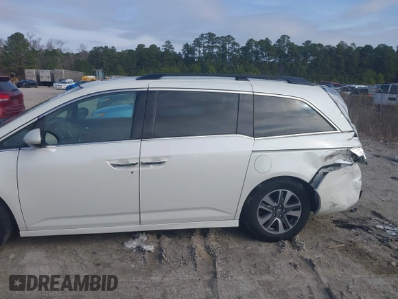 2014 Honda Odyssey Touring with VIN 5FNRL5H97EB127836, listed as a IAAI auction lot 41497413 with 174,914 mi miles and . Bid and sale history available at DreamBid. Image 14.