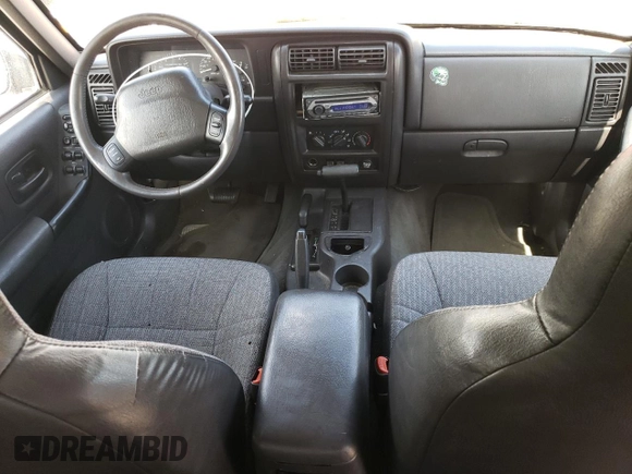1999 Jeep Cherokee Sport z VIN 1J4FF68S8XL604061, wystawiony jako Copart lot #53175345 z przebiegiem 206 698 mil mil oraz Nie do naprawy • Non repairable. Historia ofert i sprzedaży dostępna na DreamBid. Obrazek 8.