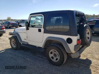 2006 Jeep Wrangler Sport Right Hand Drive with VIN 1J4F449S76P747454, listed as a Copart auction lot 77819214 with 184,763 mi miles and Salvage Title. Bid and sale history available at carsss.com. Image 2.