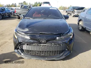 2022 Toyota Corolla Hatchback SE with VIN JTND4MBEXN3180370, listed as a Copart auction lot 74436644 with 57,563 mi miles and Salvage Title. Bid and sale history available at carsss.com. Image 5.