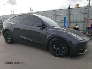2024 Tesla Model Y Long Range with VIN 7SAYGAEE5RF038446, listed as a Copart auction lot 48868025 with 10,410 mi miles and Salvage Title. Bid and sale history available at DreamBid. Image 4.