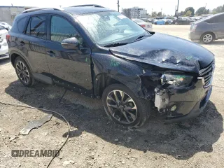 2016 Mazda CX-5 Grand Touring with VIN JM3KE2DY9G0777073, listed as a Copart auction lot 54200265 with 110,121 mi miles and Salvage Title. Bid and sale history available at carsss.com. Image 4.