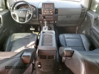 2013 Nissan Titan Pro-4X with VIN 1N6BA0EC3DN310741, listed as a Copart auction lot 57171975 with 146,524 mi miles and Salvage title. Bid and sale history available at DreamBid. Image 8.