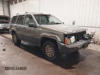 1996 Jeep Grand Cherokee Laredo with VIN 1J4GZ58S5TC182766, listed as a IAAI auction lot 41372356 with 234,390 mi miles. Bid and sale history available at carsss.com. Image 1.