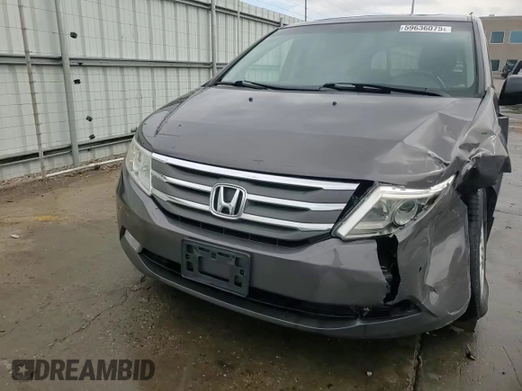 2012 Honda Odyssey Touring with VIN 5FNRL5H94CB109257, listed as a Copart auction lot 59636075 with 107,543 mi miles and Salvage title. Bid and sale history available at DreamBid. Image 14.
