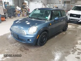 2009 MINI Hardtop with VIN WMWMF33569TU73595, listed as a IAAI auction lot 42229008 with 131,793 mi miles and . Bid and sale history available at DreamBid. Image 2.