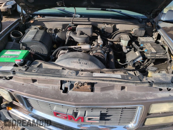 1998 GMC Suburban z VIN 3GKFK16R4WG507685, wystawiony jako Copart lot #87900735 z przebiegiem 183 033 mil mil oraz Szkoda całkowita • Salvage title. Historia ofert i sprzedaży dostępna na DreamBid. Obrazek 11.
