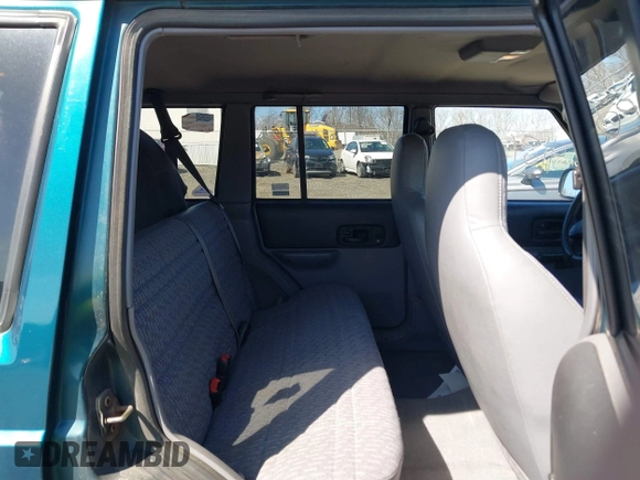 1998 Jeep Cherokee Sport z VIN 1J4FJ68S2WL136129, wystawiony jako IAAI lot #41810918 z przebiegiem 269 989 mil mil oraz . Historia ofert i sprzedaży dostępna na DreamBid. Obrazek 8.