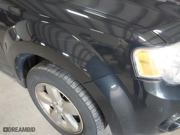 2011 Ford Escape Limited with VIN 1FMCU0EG0BKB30015, listed as a IAAI auction lot 41987953 with 203,057 mi miles. Bid and sale history available at carsss.com. Image 13.