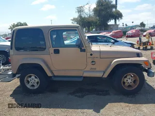 1999 Jeep Wrangler Sahara with VIN 1J4FY49S8XP462512, listed as a IAAI auction lot 42165052 with 146,135 mi miles and . Bid and sale history available at DreamBid. Image 14.
