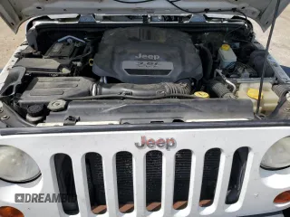 2013 Jeep Wrangler Unlimited Freedom z VIN 1C4BJWDG9DL542248, wystawiony jako Copart lot #58931345 z przebiegiem 215 667 mil mil oraz Czysty tytuł • Clean title. Historia ofert i sprzedaży dostępna na DreamBid. Obrazek 11.