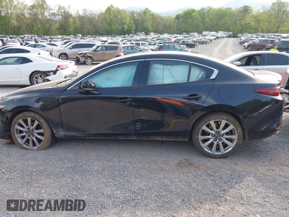 2021 Mazda 3 Premium z VIN 3MZBPADL2MM254467, wystawiony jako IAAI lot #42151557 z przebiegiem 63 282 mil mil oraz . Historia ofert i sprzedaży dostępna na DreamBid. Obrazek 15.