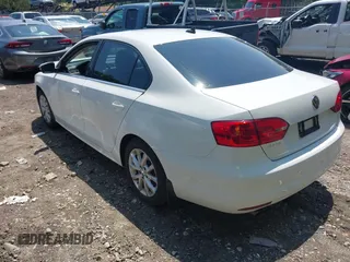 2014 Volkswagen Jetta SE with VIN 3VWD17AJ5EM437072, listed as a IAAI auction lot 42463048 with 99,030 mi miles and . Bid and sale history available at DreamBid. Image 3.