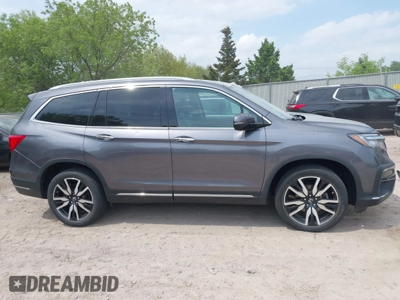 2020 Honda Pilot Elite with VIN 5FNYF6H00LB027472, listed as a IAAI auction lot 42253478 with 69,988 mi miles and . Bid and sale history available at DreamBid. Image 13.