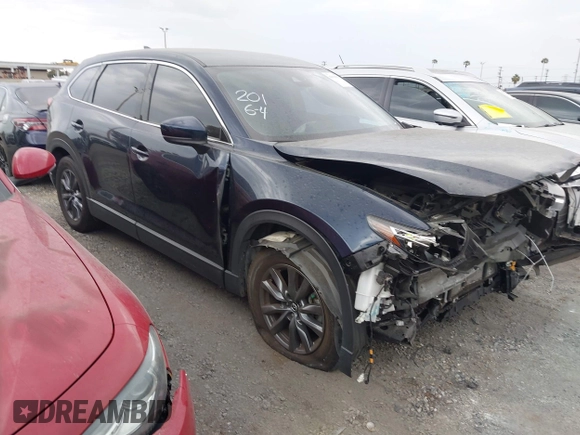 2021 Mazda CX-9 Touring with VIN JM3TCACY9M0526880, listed as a IAAI auction lot 42310923 with 25,991 mi miles and . Bid and sale history available at DreamBid. Image 1.