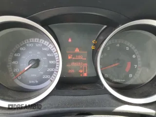 2009 Mitsubishi Lancer z VIN JA3AX88W99U613116, wystawiony jako Copart lot #58765855 z przebiegiem 256 289 mil mil oraz Czysty tytuł • Clean title. Historia ofert i sprzedaży dostępna na DreamBid. Obrazek 9.