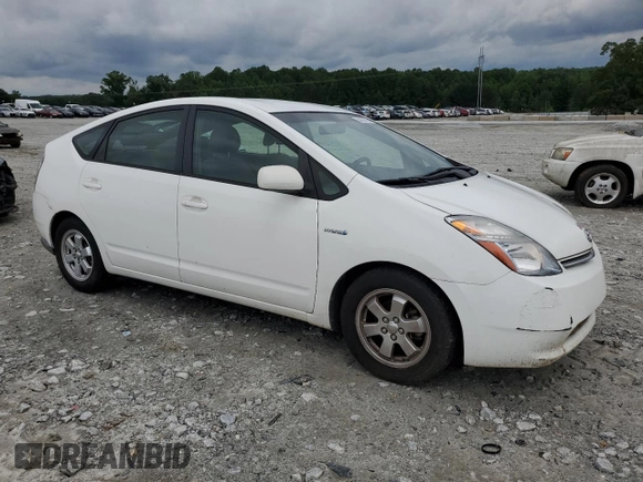 2006 Toyota Prius z VIN JTDKB20U867527026, wystawiony jako Copart lot #59057765 z przebiegiem 248 523 mil mil oraz Nie do naprawy • Non repairable. Historia ofert i sprzedaży dostępna na DreamBid. Obrazek 4.