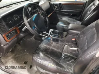 1997 Jeep Grand Cherokee Limited with VIN 1J4GZ78Y3VC733618, listed as a Copart auction lot 53757095 with 150,806 mi miles and Salvage title. Bid and sale history available at DreamBid. Image 7.