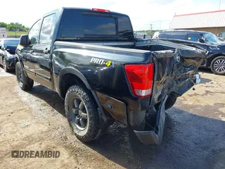 2013 Nissan Titan Pro-4X with VIN 1N6BA0EC4DN305032, listed as a IAAI auction lot 42341681 with 118,251 mi miles and . Bid and sale history available at DreamBid. Image 3.