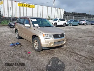 2008 Suzuki Grand Vitara w/Spare & Cargo Covers with VIN JS3TD941584100559, listed as a IAAI auction lot 42758507 with 157,741 mi miles and . Bid and sale history available at DreamBid. Image 1.