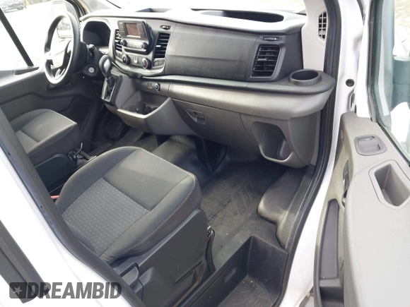 2021 Ford Transit Cargo with VIN 1FTBR1Y85MKA69355, listed as a IAAI auction lot 42544780 with 33,288 mi miles and . Bid and sale history available at DreamBid. Image 5.