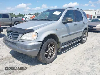 1998 Mercedes-Benz M-Class with VIN 4JGAB54E3WA031579, listed as a IAAI auction lot 42004335 with 156,898 mi miles. Bid and sale history available at carsss.com. Image 2.