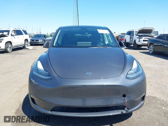 2022 Tesla Model Y Long Range with VIN 7SAYGDEE7NF426404, listed as a IAAI auction lot 42040490 with 39,635 mi miles and . Bid and sale history available at carsss.com. Image 12.