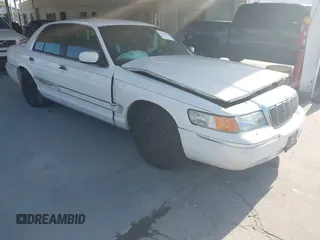 2000 Mercury Grand Marquis GS z VIN 2MEFM74W5YX605813, wystawiony jako IAAI lot #42130226 z przebiegiem 73 631 mil mil oraz . Historia ofert i sprzedaży dostępna na DreamBid. Obrazek 1.