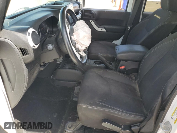 2014 Jeep Wrangler Unlimited Sahara with VIN 1C4BJWEG1EL210949, listed as a Copart auction lot 60977555 with 122,495 mi miles and Salvage title. Bid and sale history available at DreamBid. Image 7.