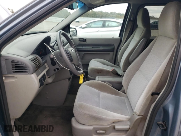 2005 Ford Freestar SE с VIN 2FMZA51615BA67146, выставлен на аукционе Copart как лот 71000634 с пробегом 84 096 миль миль и Списание • Salvage title. История ставок и продаж доступна на DreamBid. Изображение 7.