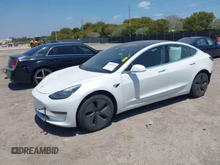 2018 Tesla Model 3 Long Range Battery with VIN 5YJ3E1EAXJF027179, listed as a IAAI auction lot 42059918 with 43,566 mi miles. Bid and sale history available at carsss.com. Image 2.