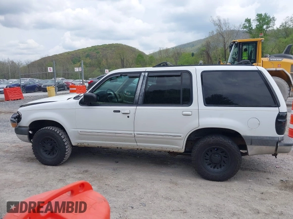 1999 Ford Explorer XLT z VIN 1FMZU34E1XZA39121, wystawiony jako IAAI lot #42107728 z przebiegiem 194 374 mil mil oraz . Historia ofert i sprzedaży dostępna na DreamBid. Obrazek 13.